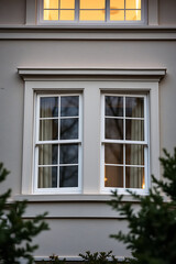 Elegant Double-Hung Windows in a Modern Home Exterior. Classic Design, High-Quality Construction, and Architectural Detail