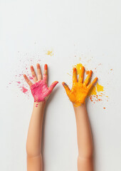 two children hands with paint on them, waving against the white sky, captured from an angle that highlights their colors and movement.