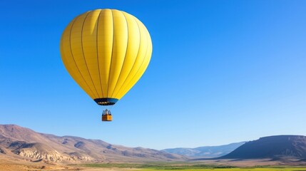 Fototapeta premium Yellow Hot Air Balloon Soaring Over Desert Mountains