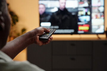 Watching Television and Holding a Remote Control