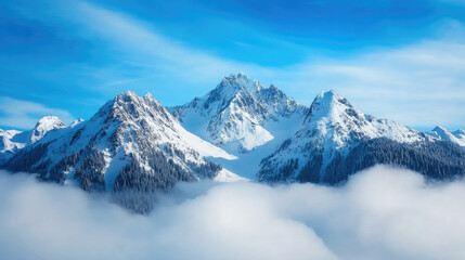 Fototapeta premium Serene snow-capped mountains rise majestically above a blanket of clouds under a bright blue sky, creating a breathtaking natural landscape.