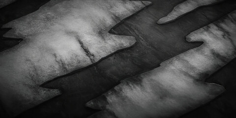 A deep charcoal black texture with soft highlights and subtle grain patterns