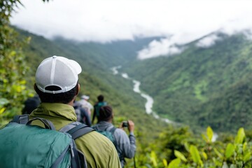 Fototapeta premium Exploring lush mountain trails with companions in a serene misty landscape