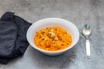 Gajar ka halwa is a rich Indian dessert made with grated carrots, milk, sugar, ghee, and nuts, slow-cooked to perfection.