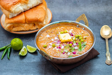 Pav Bhaji is a spicy, mashed vegetable curry served with soft buttered bread rolls, a popular street food in India.