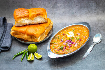Pav Bhaji is a spiced vegetable mash served with soft, buttered bread rolls, offering a hearty, comforting street food experience.