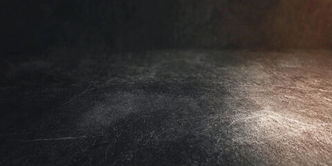 A deep charcoal black texture with soft highlights and subtle grain patterns