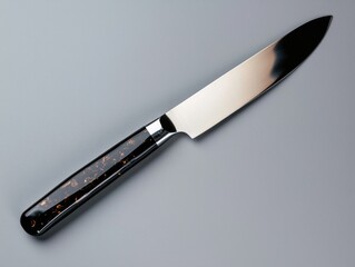 Elegant black and silver knife with a unique handle