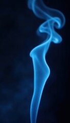 Obraz premium Ethereal blue smoke wisps curl against stark black backdrop, background, blue