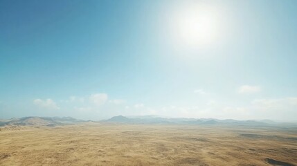 Expansive desert landscape under a bright sun, showcasing distant mountains and clear skies
