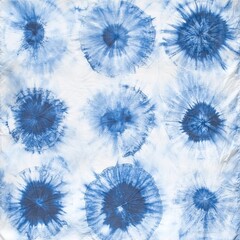 Seamless tie-dye pattern of indigo color on white silk. Hand painting fabrics - nodular batik. Shibori dyeing. 