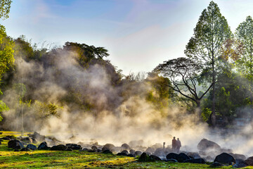 Natural hot spring with misty and morning sunrisewarm sunlight at Chae Son National Park, Lampang Province, Thailand.