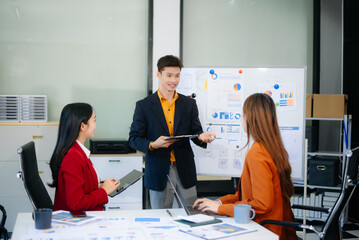 Happy businesspeople while collaborating on a new project in an office. Group of diverse businesspeople