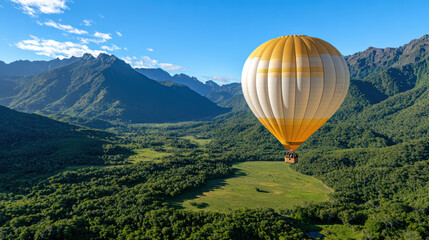 Fototapeta premium hot air balloon soaring over lush green valley surrounded by mountains