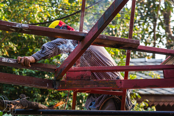 welder worker welding steel making roof on home improvement