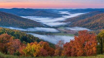 Fototapeta premium Vibrant autumn landscape showcasing rolling hills, foggy valley, and colorful foliage at dusk
