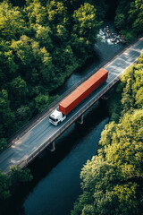 Fototapeta premium Aerial view of a container truck crossing a bridge over a river