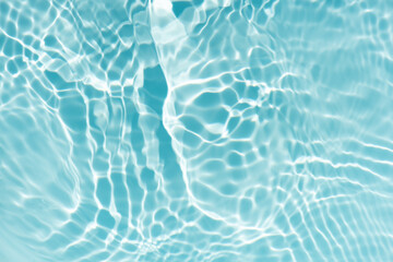 Blue water with ripples on the surface. Defocus blurred transparent blue colored clear calm water...