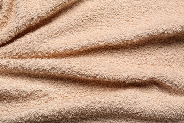 Texture of beige fluffy fabric as background