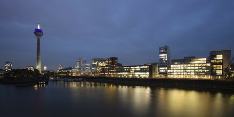 Fototapeta premium Rhine Tower and Gehri Buildings, Dusk, Media Harbour, Düsseldorf, Rhineland, North Rhine-Westphalia, Germany, Europe