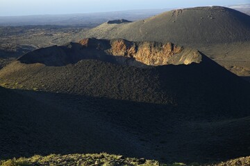 Volcanic crater in Timanfaya National Park, Montañas del Fuego, Fire Mountains, in the evening...