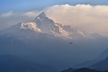 Plane flying to the sacred peak of Machhapuchhare, Pokhara, Nepal, Asia