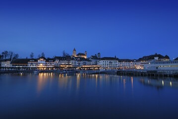 Fototapeta premium Rapperswil - the promenade and the Rapperswil castle at dawn - Canton of St. Gallen, Switzerland, Europe., Europe