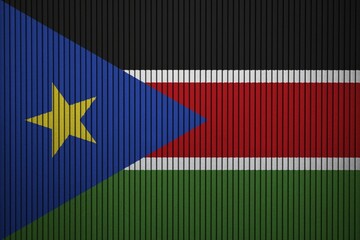 South Sudan Flag painted on the cracked grunge concrete wall