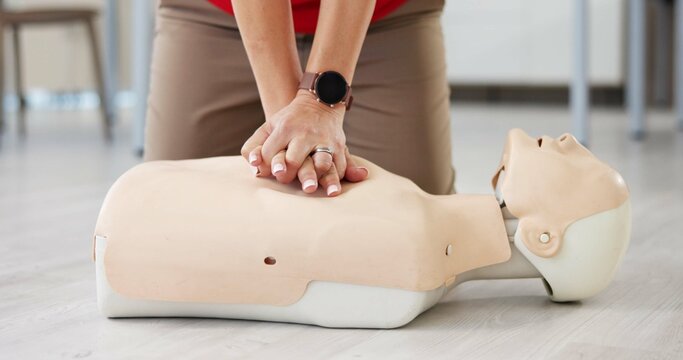 Mannequin, cpr and training with hands of person for first aid workshop, cardiac arrest and safety protocol. Healthcare class, medical simulation and heart attack rescue with paramedic course