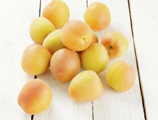 Fresh apricots on wooden ground