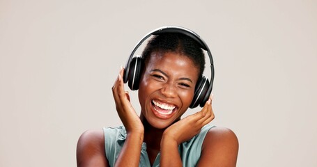 Portrait, woman and laughing with headphones on studio background for funny podcast, radio joke or...
