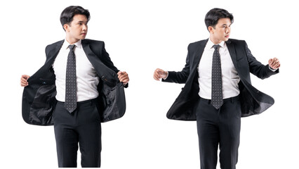 A man in a black suit and tie stands in front of a white background