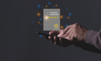 Consumer Satisfaction; Young Man hand holding Smart Phone with five star to review and give 5 stars with very good results in service, Good review 5 star rating choice feedback