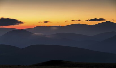 Views of the Sibillini Mountains at sunrise from Monte Serrasanta, Sibillini National Park, Parco Nazionale dei Monti Sibillini, Umbria, Italy, Europe