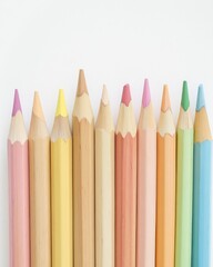 Close-up of a row of colorful pencils on a white background.