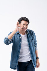 A man in a blue shirt is pointing to the sky with his finger