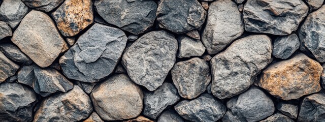 Fototapeta premium Close-up of a rustic stone wall texture.