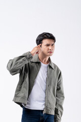 A man in a green jacket is smiling and waving