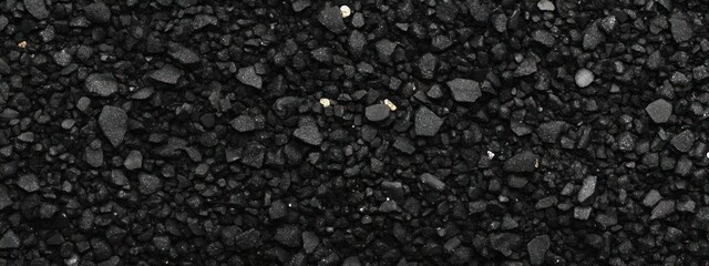 Close-up of dark grey gravel texture.