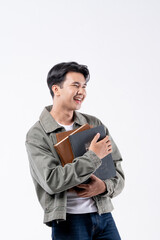 A young man and holding a stack of books
