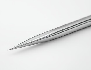 Close-up of a sharp, polished, metallic needle point.