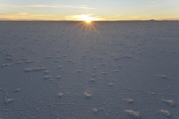 First rays of sunlight on Salar de Uyuni, salt flat, Altiplano, Lipez, Bolivia, South America