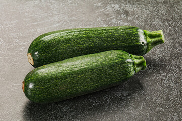 Raw green ripe zucchini vegetable