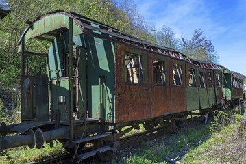 Obraz premium Discarded, dilapidated rusty wagon of a passenger train on a railroad siding, Upper Franconia, Bavaria, Germany, Europe