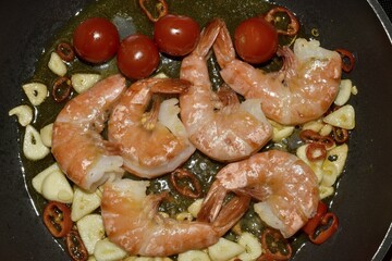 King prawns with garlic, chili and tomatoes in a pan, Tenerife, Canary Islands, Spain, Europe