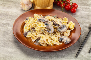 Italian cuisine - farfalle with mushrooms