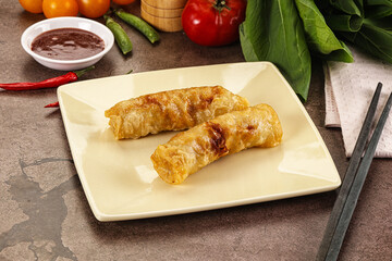 Vietnamese stuffed spring roll served sauce