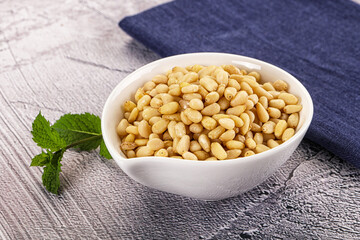 Peeled cedar nut in the bowl