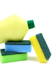 Scouring pads and abrasive cleaner isolated on white background. Cleaning products such as yellow bottle and colored sponges.