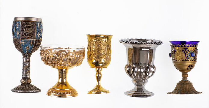 gold wine goblets isolated on white background